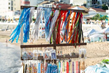 Salvador, Bahia, Brazil - February 01, 2019: View of souvenir ribbons the day before the Iemanja festival in the city of Salvador, Bahia. clipart