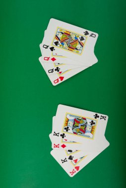 Salvador, Bahia, Brazil - May 10, 2024: Playing cards for poker and gambling, isolated on green background. clipart