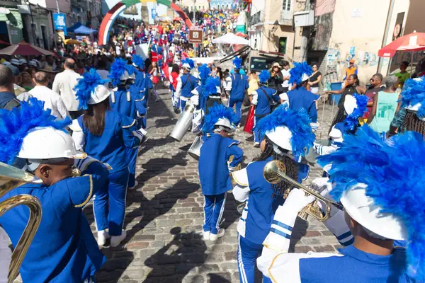 stock image Salvador, Bahia, Brazil - July 02, 2024: Public school students are seen playing wind instruments during the Bahia Independence Day parade in Pelourinho, city of Salvador.