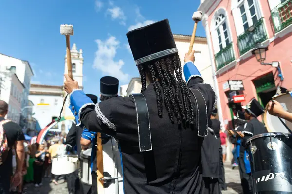 stock image Salvador, Bahia, Brazil - July 02, 2024: Public school students are seen playing musical instruments during the independence day parade of the state of Bahia, in Pelourinho, city of Salvador.