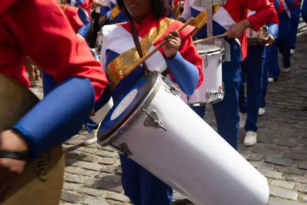 stock image Salvador, Bahia, Brazil - July 02, 2024: Public school students are seen playing musical instruments during the Dois de Julho celebration in Pelourinho, in the city of Salvador, Bahia.