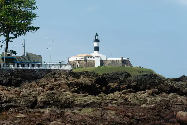 Stock image Salvador, Bahia, Brazil - September 01, 2024: Low view of the Barra Lighthouse, during a cloudy day, located in the Barra neighborhood in the city of Salvador, Bahia.