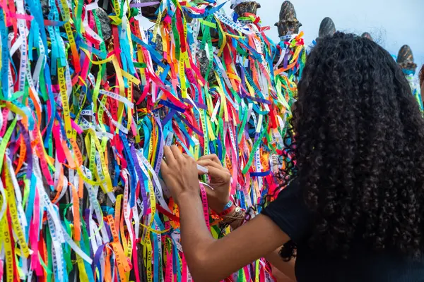 stock image Salvador, Bahia, Brazil - December 27, 2019: Tourists are seen paying homage at the gate of the Senhor do Bonfim church in Salvador, Bahia.