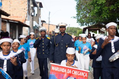 Saubara, Bahia, Brazil - August 03, 2024: A group of Marujada, dressed in character, are seen performing during a Chegancas meeting in the city of Saubara, in Bahia. clipart