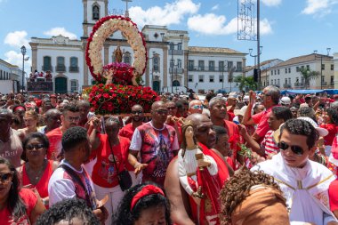 Salvador, Bahia, Brazil - December 04, 2019: Catholic faithful are seen following the procession of Saint Barbara in Pelourinho, city of Salvador, Bahia clipart