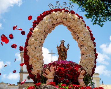 Salvador, Bahia, Brazil - December 04, 2019: Image of Saint Barbara is carried by believers during a procession in the historic center of the city of Salvador, Bahia clipart