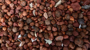 Dekoratif kahverengi taşlarla dolu çerçeve. Doku. Geçmişi. Geometri.