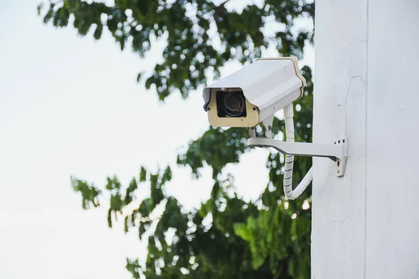 stock image security camera on a wall	