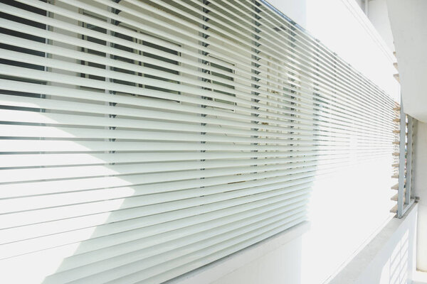 Stainless steel awning on the balcony of a modern business building