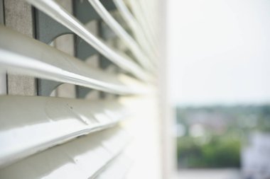 Stainless steel awning on the balcony of a modern business building clipart