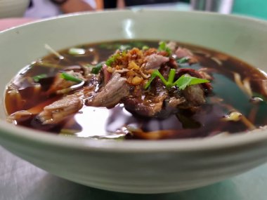 Duck soup with bean sprouts in a bowl