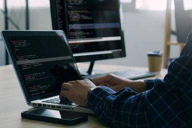 Computer programmer working on new software program.Coder recruited for solve all the script failures and renown the cyber safety of the corporation.