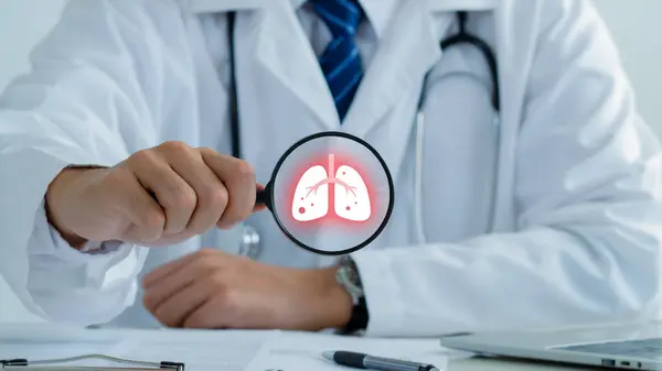 stock image Doctor holding magnifying glass to checkup lung health,respiratory disease,lung cancer,bronchitis,Bronchial Asthma,Tuberculosis,pneumonia,asthma,air pollution pm2.5 concept.world no tobacco day.