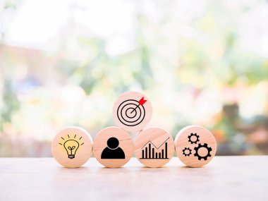 Wooden block with  business strategy icons, Action plan and business process management concept.