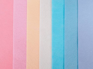 Pastel arkaplan, renkli kumaş yığını. Tam kare sessiz renkli kumaş arkaplan görüntüsü.