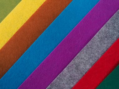 Renkli arka plan, renkli kumaş yığını. Sessiz renkli kumaş arkaplanının tam çerçeve görüntüsü