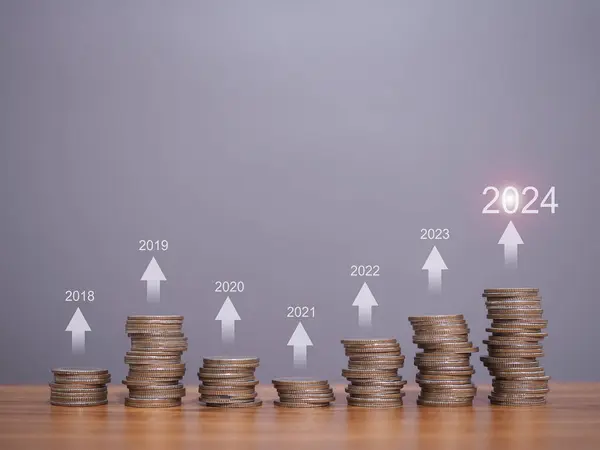 Stack of coins with arrow rising icons. The concept of business growth, Financial investment, Market stock, Profit return, Dividend and Business fund in New Year 2024