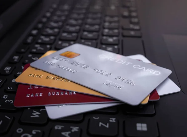 Credit cards on the laptop keyboard. The concept of Convenience in the world of technology and the internet, Online shopping, banking transaction, banking online and payment