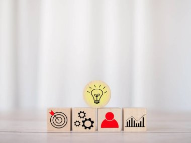 Wooden block with  business strategy icons, Action plan and business process management concept.
