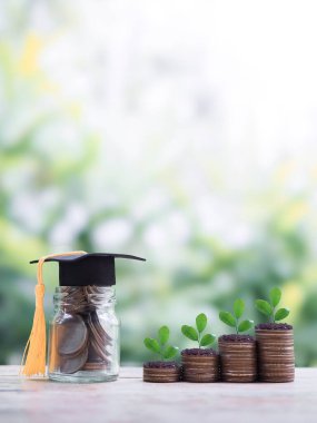 Glass bottle with graduation hat and plants growing up on stack of coins. The concept of saving money for education, student loan, scholarship, tuition fees clipart