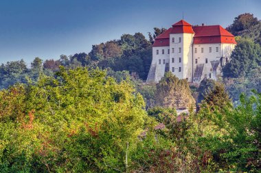 Lendava castle surrounded by lush greenery