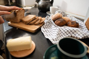 Gluten free bread cut into slices in the kitchen, healthy breakfast concept