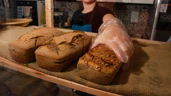 Buckwheat, oatmeal and traditional bread on the counter of a small bakery