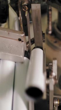 Empty aluminum containers, tubes. Aluminum tubes are filled with hair dye and sealed with special automatic equipment in a chemical factory.