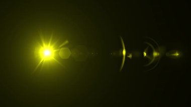Yellow optical lens flare effect. 4K resolution. Very high quality and realistic.on black background