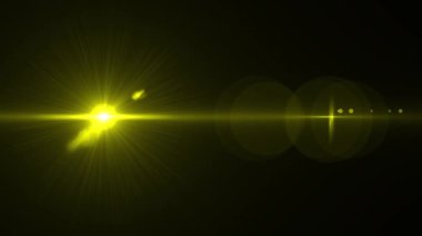 Yellow optical lens flare effect. 4K resolution. Very high quality and realistic.on black background