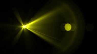 Yellow optical lens flare effect. 4K resolution. Very high quality and realistic.on black background