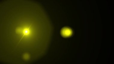 Sarı optik lens işaret fişeği etkisi. 4K çözünürlüğü. Siyah arka planda çok yüksek kalite ve gerçekçi.