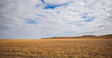 Autumn beauty of the vast plains in Haibei Tibetan Autonomous Prefecture, China. Breathtaking, amazing, endless landscapes under the bright blue sky.