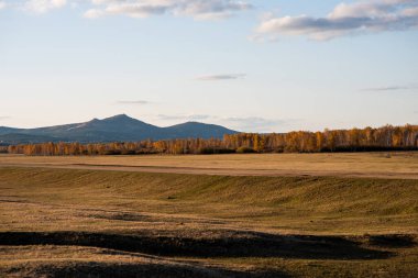 Autumn landscape of a valley near the Greater Khingan Mountains, Heilongjiang Province, China. The beauty of the world, non-tourist unexplored places of the planet.