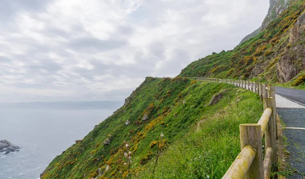 stock image Nature landscape rocky cliff shore. Cabo Ortegal lighthouse with the sea in the background on the coast of Galicia, Spain, Europe. Majestic coastline looking the Atlantic Ocean.