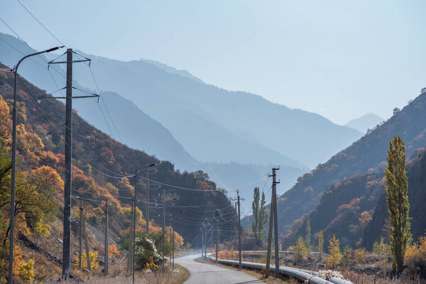 Autumn landscape in the mountains with a country road.