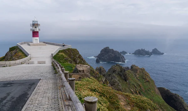 stock image Nature landscape rocky cliff shore. Cabo Ortegal lighthouse with the sea in the background on the coast of Galicia, Spain, Europe. Majestic coastline looking the Atlantic Ocean.