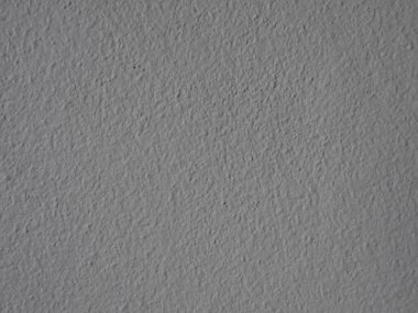 Çerçeveyi dolduran desenli bir beton duvar resmi..