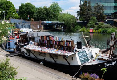 London - 06 03 2022: Word On The Water - Houseboat transformed into a book shop on the Regent's Canal in Granary Square clipart