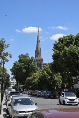 London - 06 14 2022: View of Lupus St with the spire of St Saviour's Anglican Church in the background clipart