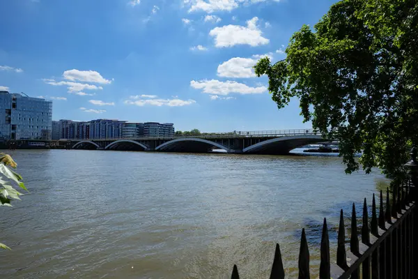 stock image London - 06 14 2022: View of the Thames and Grosvenor Bridge