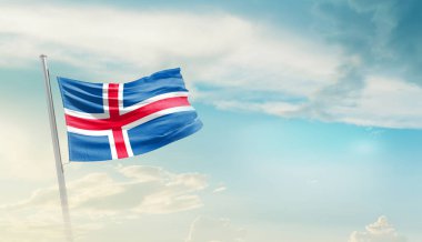 Iceland waving flag in beautiful sky.