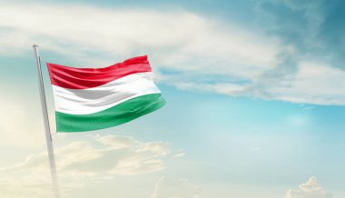 Hungary waving flag in beautiful sky.