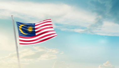 Malaysia waving flag in beautiful sky.