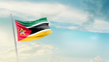 Mozambique waving flag in beautiful sky.