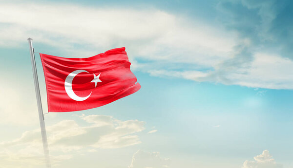 Turkey waving flag in beautiful sky.