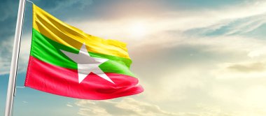 Myanmar  waving flag in beautiful sky.