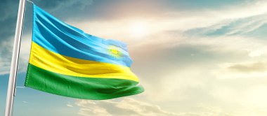 Rwanda waving flag in beautiful sky with sun