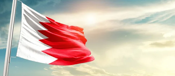 stock image Bahrain waving flag in beautiful sky with sun