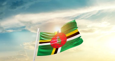 Dominica waving flag in beautiful sky with sun